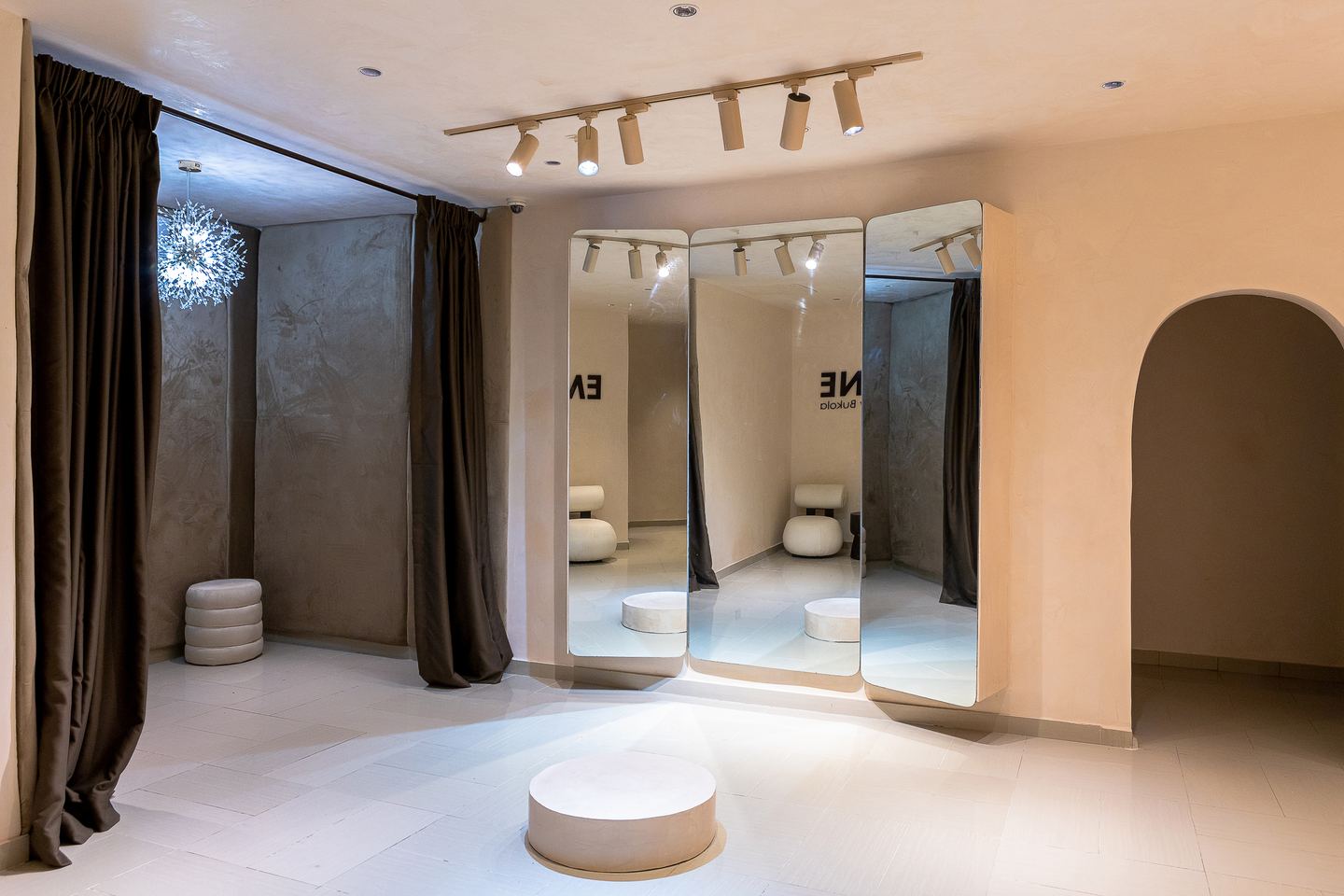 Mirrored fitting bays and ceiling track lights in the Emagine showroom