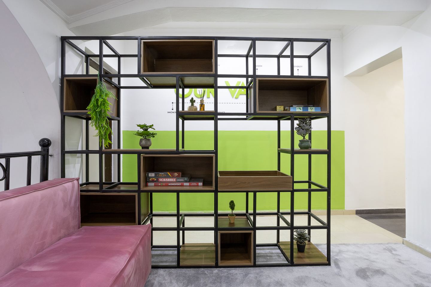 Open steel display shelving dividing the Novac lounge