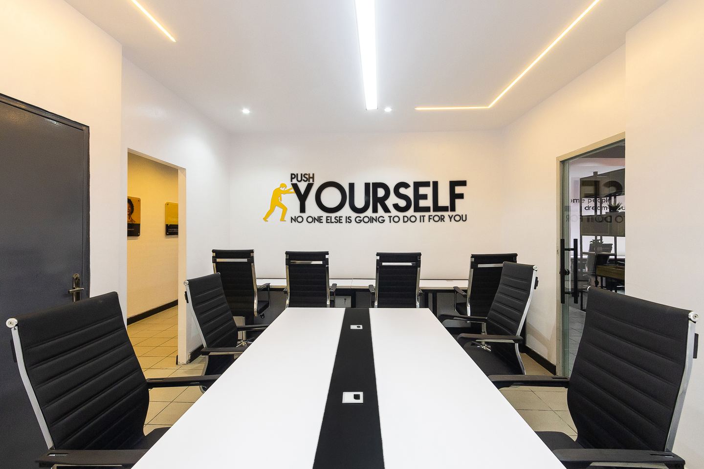 A meeting room with the studio's lettering across the end wall