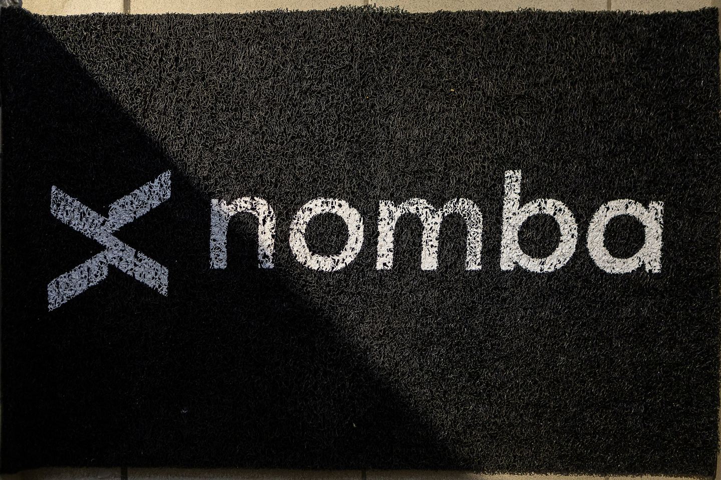 The branded mat at the entrance